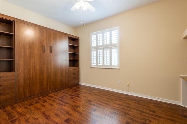 21209 Diamonte Dr, Land O Lakes, FL 34637 - unfurnished bedroom featuring baseboards, dark wood-type flooring, a closet, and ceiling fan