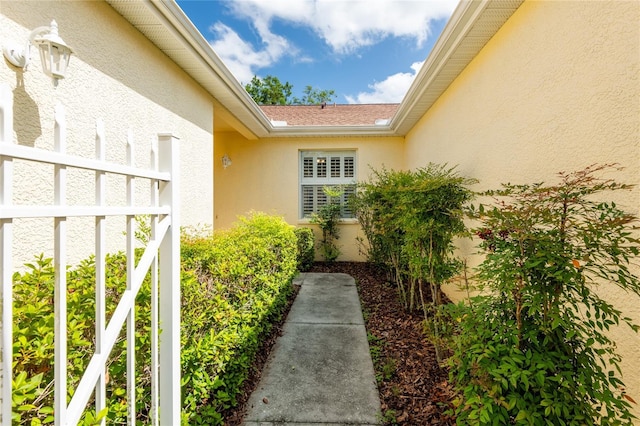 21209 Diamonte Dr, Land O Lakes, FL 34637 - view of exterior entry featuring stucco siding