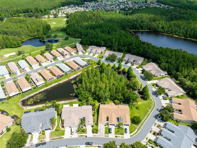21209 Diamonte Dr, Land O Lakes, FL 34637 - aerial view of property and surrounding area with nearby suburban area, a nearby body of water, a forest, and a golf course