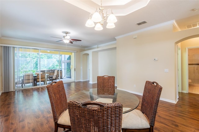 21209 Diamonte Dr, Land O Lakes, FL 34637 - dining space featuring arched walkways, ornamental molding, wood finished floors, baseboards, and a ceiling fan