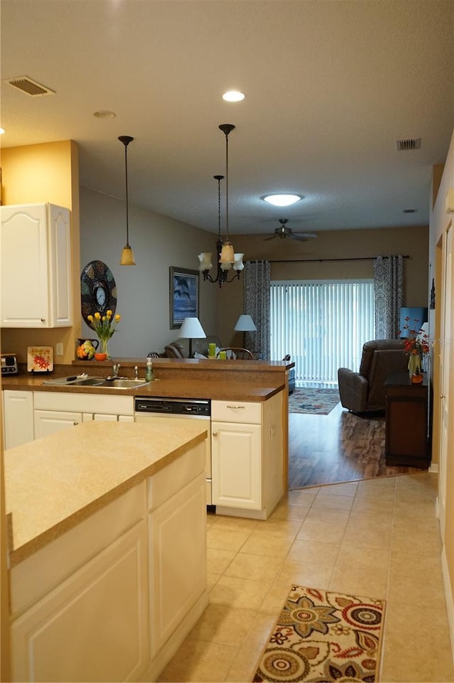 311 Kelsey Way Unit 3, Sun City Center, FL 33573 - kitchen featuring dishwasher, open floor plan, recessed lighting, a peninsula, and pendant lighting
