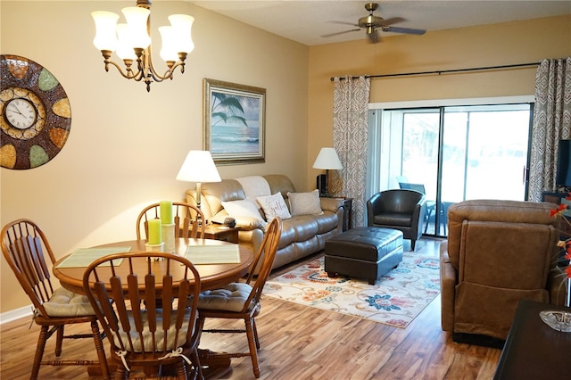 311 Kelsey Way Unit 3, Sun City Center, FL 33573 - dining space featuring wood finished floors, ceiling fan, and a chandelier
