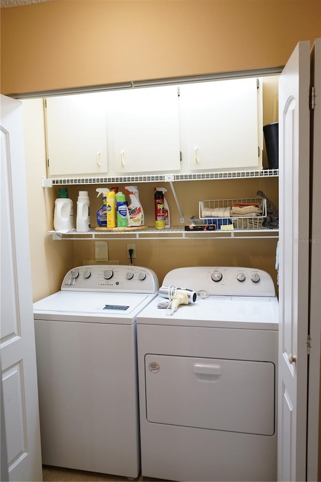 311 Kelsey Way Unit 3, Sun City Center, FL 33573 - laundry area with cabinet space and washing machine and clothes dryer