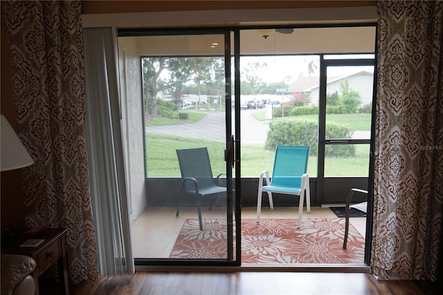 311 Kelsey Way Unit 3, Sun City Center, FL 33573 - doorway with healthy amount of natural light and wood finished floors