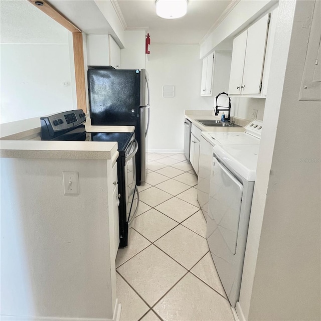 501 E Bay Dr Unit 3504, Largo, FL 33770 - kitchen with a sink, appliances with stainless steel finishes, light tile patterned floors, light countertops, and white cabinetry
