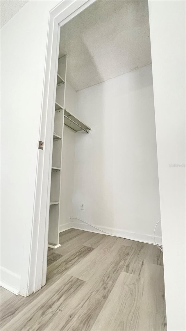 501 E Bay Dr Unit 3504, Largo, FL 33770 - spacious closet featuring wood finished floors