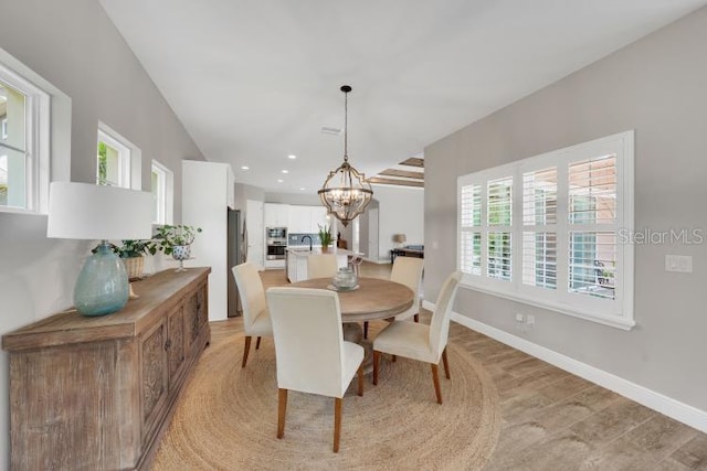 14223 Lambert Bridge Ln, Lithia, FL 33547 - dining area with a chandelier, recessed lighting, and baseboards