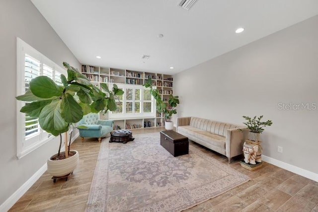 14223 Lambert Bridge Ln, Lithia, FL 33547 - living room featuring baseboards, wood finished floors, and recessed lighting