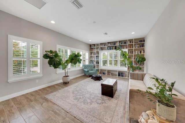 14223 Lambert Bridge Ln, Lithia, FL 33547 - living area with wood finished floors, recessed lighting, and baseboards