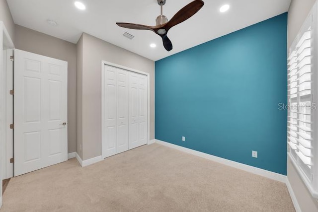 14223 Lambert Bridge Ln, Lithia, FL 33547 - unfurnished bedroom with carpet, a closet, baseboards, recessed lighting, and a ceiling fan