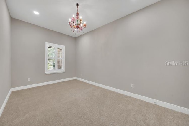 14223 Lambert Bridge Ln, Lithia, FL 33547 - unfurnished room featuring a chandelier, carpet flooring, baseboards, and recessed lighting