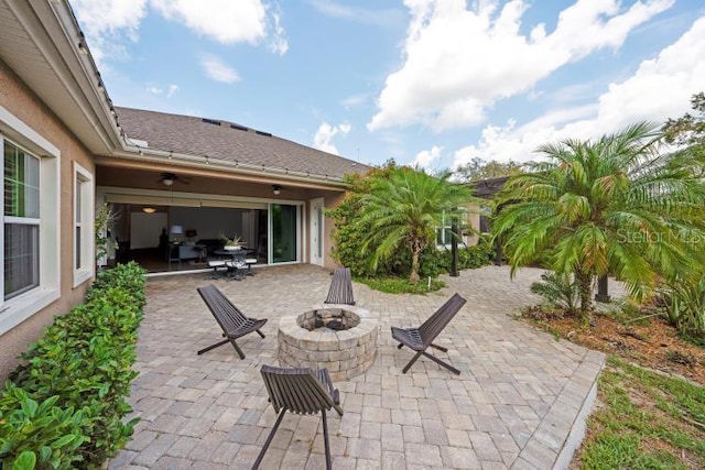 14223 Lambert Bridge Ln, Lithia, FL 33547 - view of patio / terrace with a fire pit