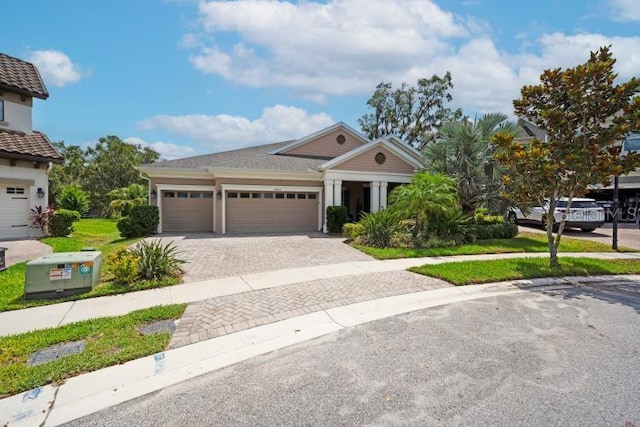 14223 Lambert Bridge Ln, Lithia, FL 33547 - view of front facade featuring a garage and decorative driveway