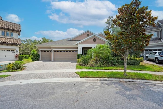 14223 Lambert Bridge Ln, Lithia, FL 33547 - view of front of property with decorative driveway and an attached garage