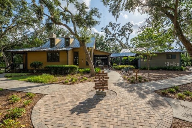 14223 Lambert Bridge Ln, Lithia, FL 33547 - view of front facade featuring metal roof