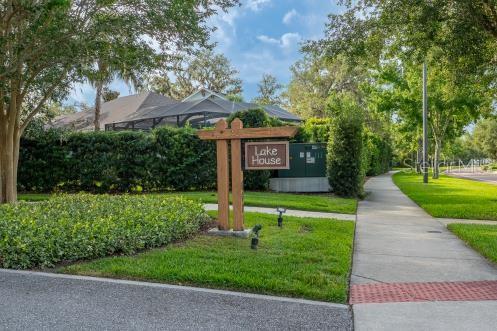 14223 Lambert Bridge Ln, Lithia, FL 33547 - view of home's community with a yard