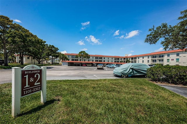 2700 Bayshore Blvd Unit 2110, Dunedin, FL 34698 - view of home's community with uncovered parking and a yard