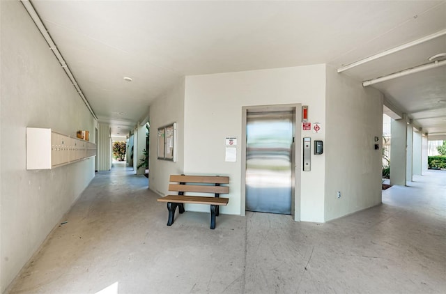 2700 Bayshore Blvd Unit 2110, Dunedin, FL 34698 - corridor with elevator and concrete floors