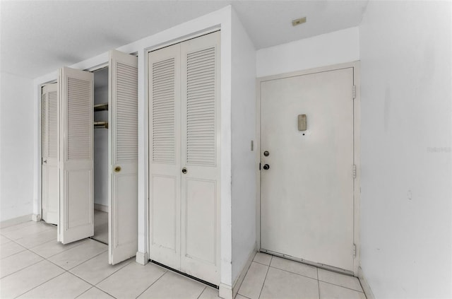 2700 Bayshore Blvd Unit 2110, Dunedin, FL 34698 - entrance foyer with light tile patterned flooring and baseboards