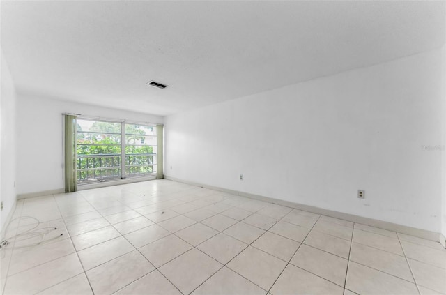 2700 Bayshore Blvd Unit 2110, Dunedin, FL 34698 - unfurnished room featuring baseboards and light tile patterned floors