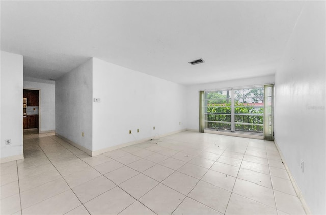 2700 Bayshore Blvd Unit 2110, Dunedin, FL 34698 - empty room with light tile patterned floors