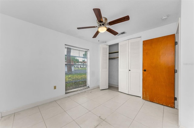 2700 Bayshore Blvd Unit 2110, Dunedin, FL 34698 - unfurnished bedroom with a closet and a ceiling fan