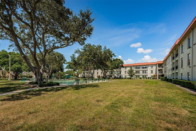 2700 Bayshore Blvd Unit 2110, Dunedin, FL 34698 - surrounding community with a yard