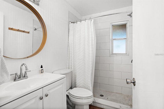 1045 28th Ave S, Saint Petersburg, FL 33705 - bathroom featuring vanity, toilet, and a tile shower