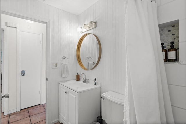 1045 28th Ave S, Saint Petersburg, FL 33705 - bathroom featuring vanity, toilet, and tile patterned floors