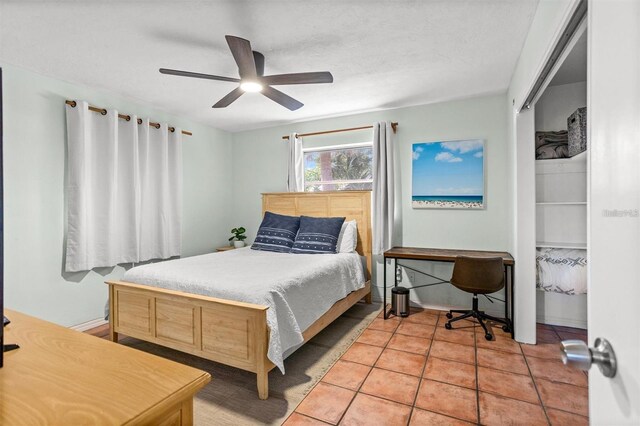 1045 28th Ave S, Saint Petersburg, FL 33705 - bedroom featuring a ceiling fan, light tile patterned floors, and baseboards