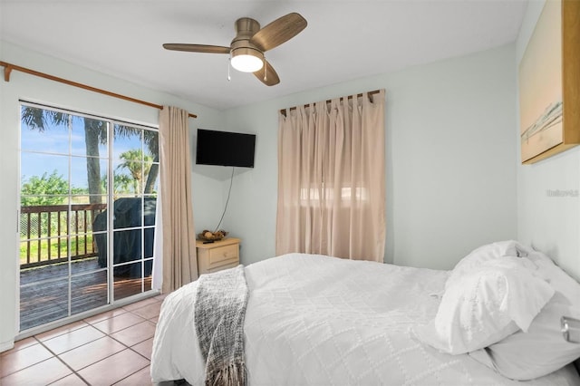 1045 28th Ave S, Saint Petersburg, FL 33705 - bedroom with access to exterior, light tile patterned floors, and a ceiling fan