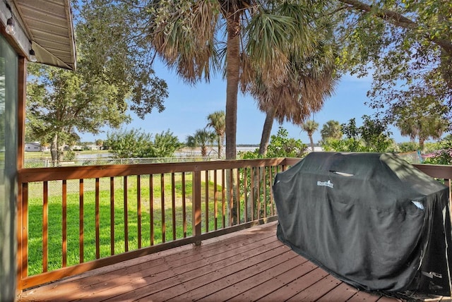1045 28th Ave S, Saint Petersburg, FL 33705 - wooden terrace featuring a grill