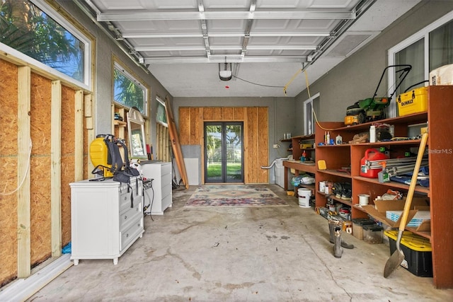 1045 28th Ave S, Saint Petersburg, FL 33705 - garage featuring french doors and washer / dryer