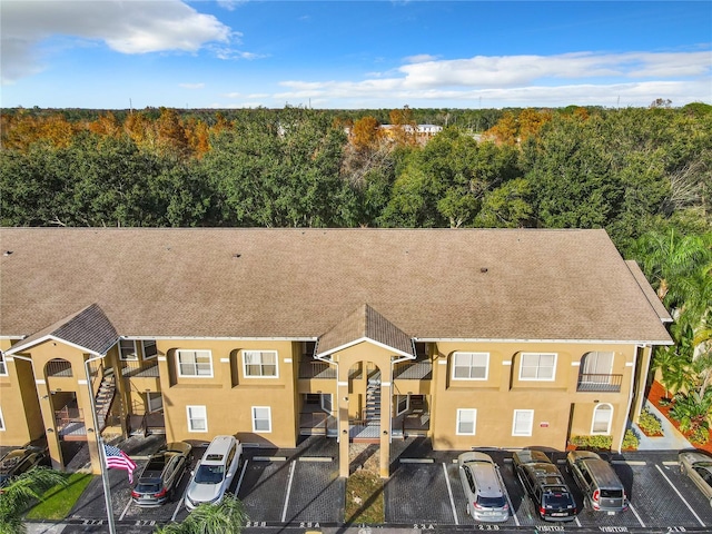 view of property with uncovered parking