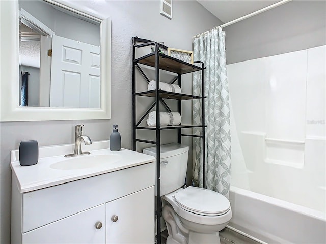 full bath featuring toilet, vanity, and shower / tub combo with curtain