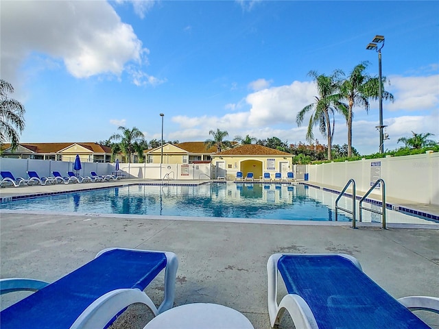 community pool featuring a patio area