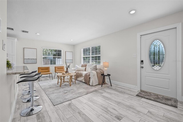 812 60th St S, Gulfport, FL 33707 - foyer entrance with light wood-style flooring, baseboards, and recessed lighting