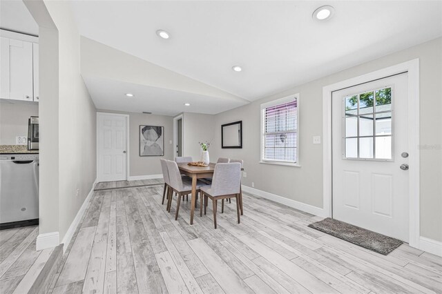 812 60th St S, Gulfport, FL 33707 - dining space featuring light wood-style floors, vaulted ceiling, baseboards, and recessed lighting