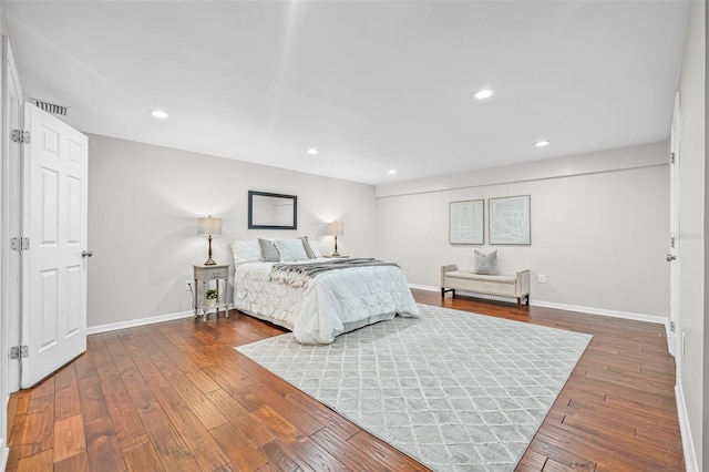 812 60th St S, Gulfport, FL 33707 - bedroom featuring baseboards, wood-type flooring, and recessed lighting
