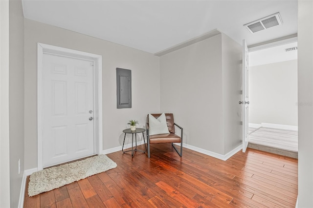 812 60th St S, Gulfport, FL 33707 - foyer with electric panel, hardwood / wood-style flooring, and baseboards