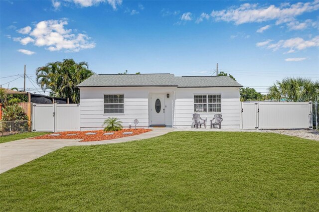 812 60th St S, Gulfport, FL 33707 - view of front of house with a gate