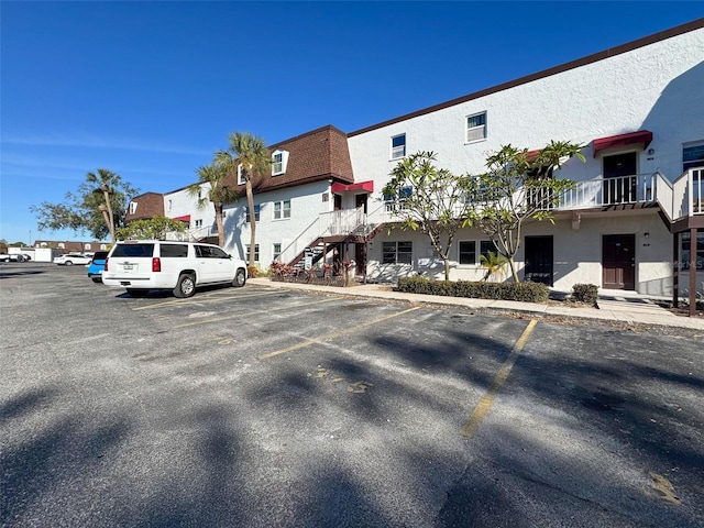 9201 Tudor Dr Unit C212, Tampa, FL 33615 - view of building exterior featuring uncovered parking and a residential view