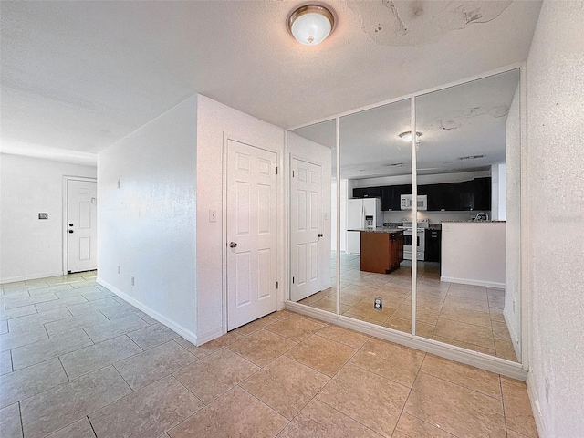 9201 Tudor Dr Unit C212, Tampa, FL 33615 - empty room featuring baseboards