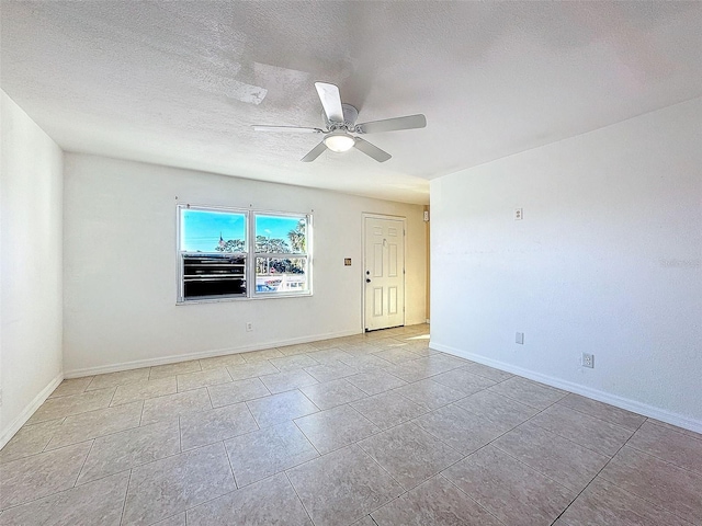 9201 Tudor Dr Unit C212, Tampa, FL 33615 - tiled empty room featuring ceiling fan, a textured ceiling, and baseboards