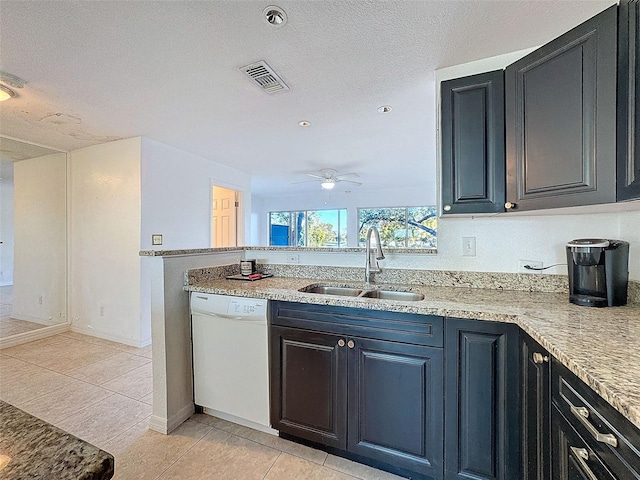 9201 Tudor Dr Unit C212, Tampa, FL 33615 - kitchen with white dishwasher, a sink, light tile patterned flooring, and ceiling fan