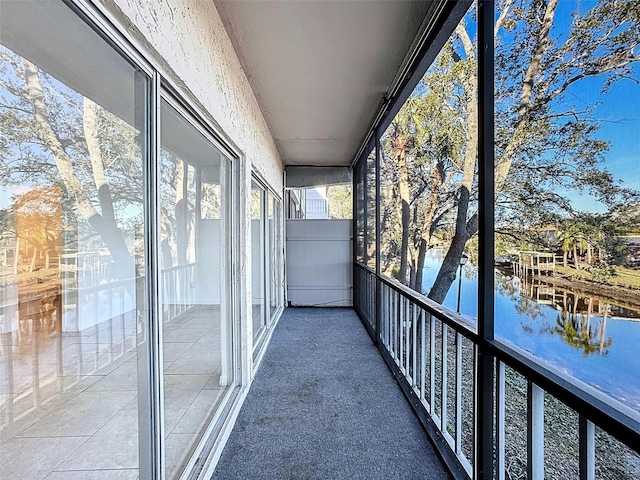 9201 Tudor Dr Unit C212, Tampa, FL 33615 - unfurnished sunroom with a water view