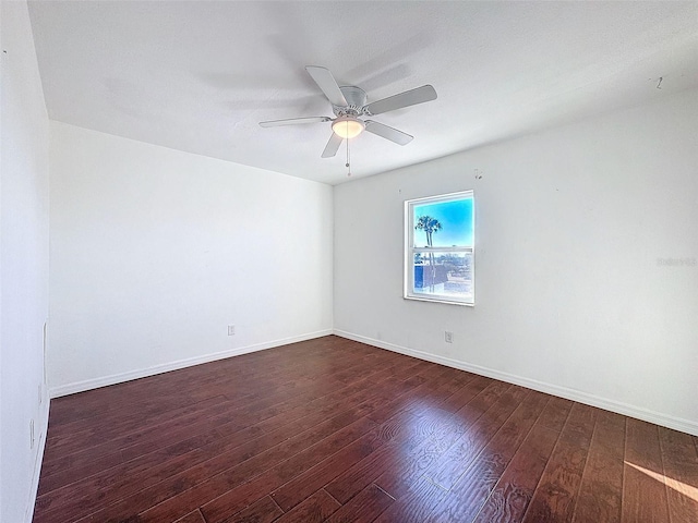 9201 Tudor Dr Unit C212, Tampa, FL 33615 - spare room with dark wood-type flooring, a ceiling fan, and baseboards