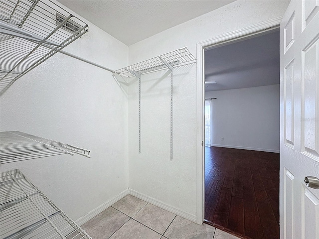 9201 Tudor Dr Unit C212, Tampa, FL 33615 - walk in closet with light tile patterned flooring