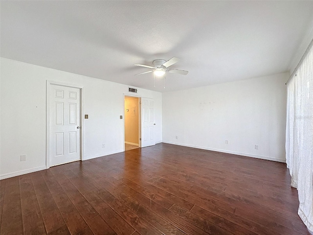 9201 Tudor Dr Unit C212, Tampa, FL 33615 - empty room featuring ceiling fan, dark wood-style flooring, and baseboards