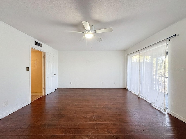 9201 Tudor Dr Unit C212, Tampa, FL 33615 - empty room with a ceiling fan, dark wood-style flooring, baseboards, and a textured ceiling
